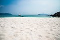 Beautiful tropical island white sand beach blue sky sunny day - Royalty Free Stock Photo