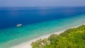 Beautiful tropical landscape of the beach and boat in the ocean at the island Manadhoo the capital of Noonu atoll Royalty Free Stock Photo