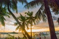 Beautiful tropical landscape with palm trees at sunset. Boracay, Philippines