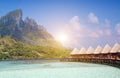 Beautiful tropical Maldives island, water villas, bungalow on sea and the mountain on a background Royalty Free Stock Photo