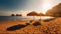 A beautiful tropical sandy beach with evening golden hour sunset glaring, and some umbrella chair beach, mountain cliff at the