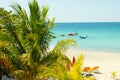 Beautiful tropical sandy beach with palms and boat in turquise caribbean sea at Jamaica Royalty Free Stock Photo