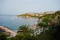 Beautiful tropical sea bay with palms. Scenic landscape with mountain islands and blue lagoon on Aegean sea. Exotic scenery. Royalty Free Stock Photo