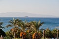 Beautiful tropical sea bay with palms. Scenic landscape with mountain islands and blue lagoon on Aegean sea. Exotic scenery. Royalty Free Stock Photo