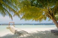 Beautiful tropical sunny beach landscape view with palm trees and ocean,blue sky, cabana at the island at resort Royalty Free Stock Photo