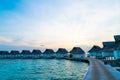Beautiful tropical sunset over Maldives island with water bungalow in hotel resort Royalty Free Stock Photo
