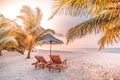 Romantic beach sunset, landscape of tropical island with palm trees and white sand. Luxury vacation and honeymoon destination Royalty Free Stock Photo