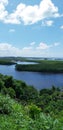 Beautiful tropical view of river and mangrove green vegetation on blue sky with clouds in Porto Seguro - Bahia - Brazil Royalty Free Stock Photo