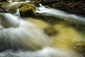 Beautiful tropical waterfall in lush surrounded by green forest.wet rock and moss.