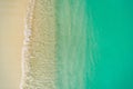 Beautiful tropical white empty beach and sea waves seen from above. Maldives beach aerial view. Top view from drone