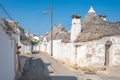 Group of beautiful Trulli, traditional Apulian dry stone wall hut old houses with a conical roof in Alberobello Royalty Free Stock Photo