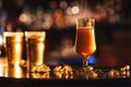 beautiful tulip glass with foamy golden beer ale on bar counter Royalty Free Stock Photo