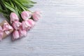 Beautiful tulips and gift box for Mother`s Day on wooden background, Royalty Free Stock Photo