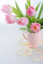 Beautiful tulips in a vase with decorative paper Royalty Free Stock Photo
