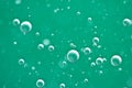 Beautiful turquoise background Rising air bubbles in clear water. Oxygen. Macro Royalty Free Stock Photo