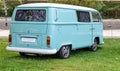 Beautiful turquoise classic Volkswagen Kombi van during an exhibition in a park
