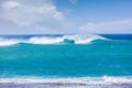 Turquoise crushing waves near ocean coast.