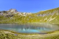 Beautiful turquoise mountain lake surrounded by alpine pastures and mountains - Lake Engeratsgundsee and Grosser Daumen Mountain, Royalty Free Stock Photo
