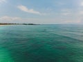 Beautiful turquoise ocean water with boat on it top view aerial photo. Royalty Free Stock Photo