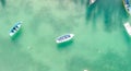 Beautiful turquoise ocean water with wooden boat on the water. Top view aerial photo Royalty Free Stock Photo