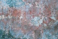 Beautiful turquoise, red and grey grunge rough artistic old stone wall with cracks and scratches Royalty Free Stock Photo