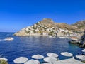 Beautiful turquoise rocky seascape with a famous swimming place full of tourists and visitors near Hydronetta coctail bar in Hydra Royalty Free Stock Photo