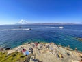 Beautiful turquoise rocky seascape with a famous swimming place full of tourists and visitors near Hydronetta coctail bar in Hydra Royalty Free Stock Photo