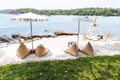 Beautiful turquoise sea and bean bags on white sand beach with umbrella in sunny day Royalty Free Stock Photo