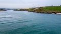 Beautiful turquoise sea water. Clonakilty Bay, the southern coast of Ireland. Seaside landscape on a cloudy day. Nature of Royalty Free Stock Photo