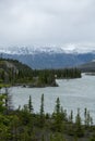 Beautiful turquoise waters lake with snow-covered peaks above it in Banff National Park of Canada Royalty Free Stock Photo