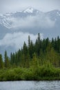 Beautiful turquoise waters lake with snow-covered peaks above it in Banff National Park of Canada Royalty Free Stock Photo