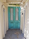 Beautiful turquoise wooden door in the old building, Cape Town