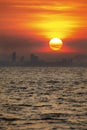 Beautiful twilight sunrise in the morning at Thailand paradise sea bay with cloud sky and big city silhouette town building Royalty Free Stock Photo