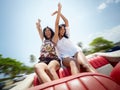 Beautiful twin sisters having fun in cabriolet car Royalty Free Stock Photo