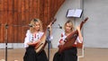 Beautiful twin sisters playing banduras - Ukrainian string instrument