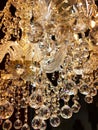 Beautiful twinkle crystal chandelier close up, warm light