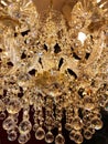 Beautiful twinkle crystal chandelier close up, warm light Royalty Free Stock Photo