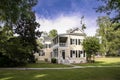 Beautiful two story home with manicured lawn and garden