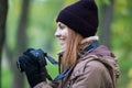 Beautiful twoman tourist travel photographer photographing forest at autumn day