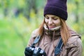 Beautiful twoman tourist travel photographer photographing forest at autumn day Royalty Free Stock Photo