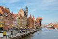 Beautiful typical colorful houses buildings and Zuraw Crane at Long Bridge embankment promenade street and boats ships on Motlawa Royalty Free Stock Photo