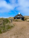 Beautiful typical house in the nature of Skagen in northern Jutland in Denmark, Skagerrak, North Sea