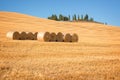 Beautiful typical landscape of Val d`Orcia in Tuscany with hay bales in a field in summer, Val d`Orcia, Tuscany Italy