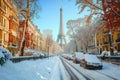 Beautiful typical Parisian street covered in snow in France. Sunny cold day on winter time