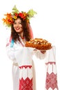 Beautiful ukrainian woman in garland and native costume holding