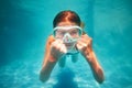 Strong positive girl swim underwater in scuba mask Royalty Free Stock Photo