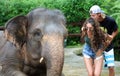 Beautiful unique elephant with couple at an elephants conservation reservation in Bali Indonesia