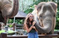 Beautiful unique elephant with girl at an elephants conservation reservation in Bali Indonesia
