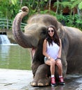 Beautiful unique elephant with girl at an elephants conservation reservation in Bali Indonesia