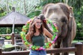 Beautiful unique elephant with girl at an elephants conservation reservation in Bali Indonesia